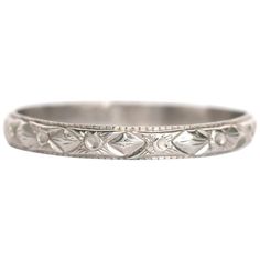 an antique style wedding band in white gold