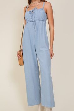 THE PERFECT MIX OF FLIRTY AND FUN, THIS JUMPSUIT IS READY FOR ANY SUMMER OCCASIONS. THE FLOWY SILHOUETTE IS COMPLEMENTED BY A SQUARE NECK LINE, RUCHED BUST, AND FRONT KEYHOLE DETAILS. WHETHER YOU ARE SIPPING COCKTAILS OR DANCING THE NIGHT AWAY, THIS DENIM BLUE JUMPSUIT WILL HAVE YOU FEELING THE BEST.* SLEEVELESS DESIGN* SPAGHETTI STRAP* SELF FRONT TIE* FRONT KEY HOLE* LIGHTWEIGHT MATERIAL* THE MODEL IS 5'9" AND WEARING SIZE SMALLMade In: ChinaFabric Contents: 90% cotton 10% viscoseSize Measureme Jumpsuit Fitted, Blue Jumpsuit, Jumpsuit Summer, Blue Jumpsuits, Tie Sleeve, Sleeveless Jumpsuits, Denim Jumpsuit, Light Denim, Sheer Fabrics