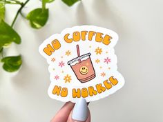 someone holding up a sticker that says no coffee no workee