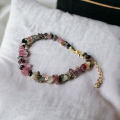 "THE BEST assorted style natural gemstone beaded bracelets! Introducing our boho vintage style bracelet that's completely beaded with small crystal beads with an adjustable end.   Our idea in creating this bracelet is so that people would feel a connection with the nature as well as the message behind the gemstone. Here are the meanings of the different stone beads that we offer here: Rose Quartz: Rose Quartz brings good luck in personal relationships with people. The stone has an energy that attracts love. It brings warmth and love to any relationship, not necessarily even love relationships. The stone promotes letting go of negative and outdated emotions, allowing one to move forward and achieve success. Amethyst: This precious stone is believed to attract peace, harmony, and balance. Fo Dainty Adjustable Beaded Bracelets With Natural Stones, Casual Gemstone Beads Crystal Bracelet Gift, Casual Crystal Bracelet With Natural Stones As A Gift, Casual Crystal Bracelet With Natural Stones For Gift, Bohemian Tourmaline Jewelry With Natural Stones, Casual Natural Stone Crystal Bracelet As Gift, Bohemian Tourmaline Round Beads Jewelry, Bohemian Tourmaline Bead Jewelry, Trendy Beaded Bracelets With Natural Stones For Gift