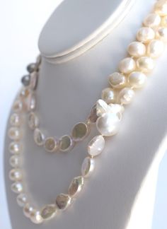 Materials- 9-10 mm near-round freshwater pearls, 11-14 mm oval coin freshwater pearls, (1) XL rare nucleated baroque pearl, 14k gold-filled bead clasp SizeLength: 37", can be worn long or doubled Each piece is limited edition and meticulously handcrafted by me in my Florida home studio. Please allow 3-5 days for production. Cheap Statement Pearl Necklace With Round Beads, Luxury Pearl Necklace With Round Beads, Luxury Classic Pearl Necklace With Round Beads, Luxury Round Beads Pearl Necklace For Festivals, Luxury Pearl Necklace With Lobster Clasp And Round Beads, Luxury Round Pearl Bead Jewelry, Luxury Bohemian Pearl Necklace With Round Beads, Luxury Vintage Round Bead Pearl Necklace, Luxury Pearl Drop Necklace With Round Beads