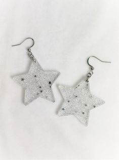 Sparkle Star Earrings – retroelo Handmade Trendy Silver Plug Earrings, Trendy Handmade Silver Plug Earrings, Trendy Nickel-free Silver Plug Earrings, White Star-shaped Metal Jewelry, Silver Star-shaped Pierced Earrings, Trendy Silver Star Charm Earrings, Trendy Silver Star Earrings, Trendy Silver Earrings With Star Charm, Silver Star-shaped Earrings As Gift