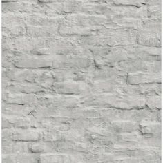 an old white brick wall textured with cement