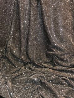 a black and silver cloth with glitter on it