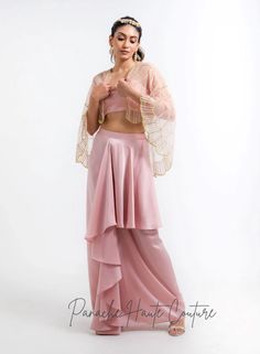 Dusty Pink Color Dhoti Skirt with Cape – Panache Haute Couture Silk Bollywood Draped Sharara, Silk Draped Lehenga For Designer Wear, Draped Art Silk Sets With Dupatta, Pink Draped Sets With Zari Work, Festive Draped Silk Sharara, Diwali Draped Sets With Dupatta, Traditional Unstitched Draped Sets, Bollywood Style Draped Art Silk Lehenga, Bollywood Draped Art Silk Lehenga