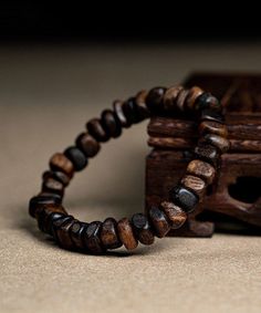 The exquisite Retro Brown Sandalwood Buddha Beads Bracelet is a true work of art, exuding an air of sophistication and exclusivity. Handcrafted with precision and attention to detail, this bracelet boasts a timeless appeal that is reminiscent of old-world luxury. The warm hues of brown sandalwood perfectly complement the intricate Buddha beads, making it a must-have accessory for the discerning fashion connoisseur. Elevate your style with this exquisite bracelet and embrace the elegance it exude Trending Shoes For Men, Buddha Bracelet Beads, Accessories Guide, Spiritual Bracelets, Buddha Bracelets, Buddha Beads, Daily Hairstyles, Stylish Bracelet, Clothes For Men