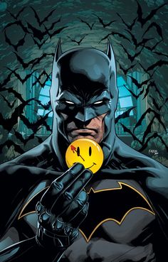 a batman holding a smiley face ball in his hand