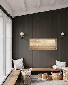 an empty room with wooden paneling and white pillows on the floor next to a bench