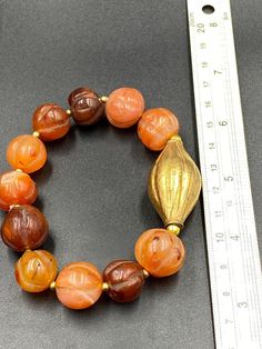 Old ancient carnelian pumpkin shape beaded bracelet Vintage Amber Beads Gems And Cabochons For Gift, Traditional Orange Jewelry For Healing, Traditional Orange Healing Jewelry, Gold Bracelets With Faceted Beads, Vintage Faceted Beads Gems And Cabochons As A Gift, Vintage Faceted Beads For Gifts, Artisan Orange Bracelets As Gift, Handmade Orange Spiritual Bracelets, Vintage Carnelian Polished Beads Jewelry