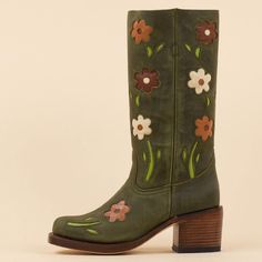 These cowgirl boots feature a dark green hue, square toe design, block heel for comfort, and blossom detailing around the mid-calf area, blending classic Western style with contemporary flair. Color: Dark green Heel Type: Block heel Heel Height: 2.36" / 60 mm approx Shaft Height: 11.81'' / 300 mm approx Product measurements were taken using size 8. Please note that measurements may vary by size. Toe: Square toe Flower blossom design Pull-on design Handcrafted US sizing. Fits true to size. Retro Boots, Cowboy Boots For Women, Flower Boots, Green Boots, Green Heels, Green Square, Shoe Inspiration, Swag Shoes, Goodyear Welt