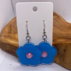 Handmade Blue Daisy Flower Earrings Silver Hook Earrings Blue/Purple Center Made in the USA Trendy Blue Flower Earrings, Blue Flower Charm Drop Earrings, Trendy Light Blue Drop Earrings, Blue Flower Earrings Nickel Free, Blue Flower Earrings For Pierced Ears, Trendy Blue Resin Jewelry, Trendy Light Blue Dangle Earrings, Blue Flower Charm Earrings, Resin Flower Charm Drop Earrings