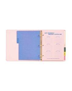 a pink and blue binder with writing on the front, sitting next to a white background