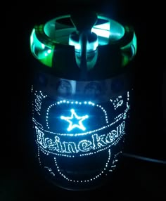 a light up beer can in the dark with some lights on it's side