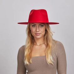 Rancher Vivid | Womens Colored Felt Fedora Hat is perfect for women who want to make a bold statement. Crafted from wool felt with a wide brim, its vibrant colors and sleek design add a pop of style to any look. Material: Wool Felt Shape: Tear Drop Western Trim: No Trim Brim Size: 3 1/2" Crown Height: 4 1/8" Sweatband: Adjustable Velcro Sweatband Imported Trendy Red Hat With Curved Brim, Red Fedora Felt Beach Hat, Red Fedora Felt Hat For Beach, Red Fedora Felt Hat For The Beach, Red Fedora With Short Brim For Fall, Red Fedora Felt Hat For Party, Red Casual Panama Hat With Curved Brim, Casual Red Panama Hat With Curved Brim, Chic Red Hats For The Beach