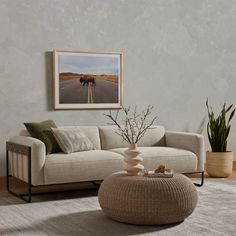 a living room scene with focus on the couch and coffee table in the center area