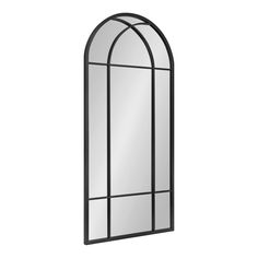 an arched mirror with black frame on a white background