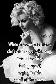 a woman sitting on the ground with her hand in her mouth and a quote above it