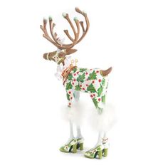 a christmas reindeer figurine with holly and berries on it's antlers