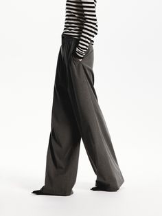 MO&Co. Women's Pleated Wide Leg Pants Crafted from well-done fabric, these wide-leg pants have been designed to fall loosely over the body. With convenient side slip pockets and a front pleated design that creates a flattering silhouette. Features : - Relaxed wide-leg silhouette- Side slip pockets, back welt pockets- Front pleated design Code: MBD3PATT03The back length of size M is 108cmMATERIALS & CARE Material: 66.8% Polyester 30.9% Viscose 2.3% SpandexPlease put it into a mesh bag to wash.REM Pleated Wide Leg Pants, Mesh Bag, Welt Pocket, Welt Pockets, Leg Pants, Black Pants, Wide Leg Pants, Black And Grey, Wide Leg