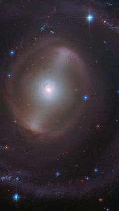 an image of a spiral galaxy with stars in the background, taken from earth's hubble