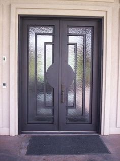 a black double door with glass on the outside