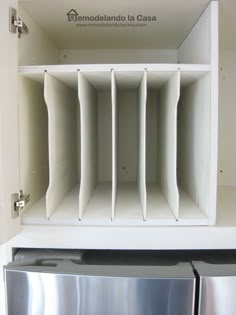 a white shelf with several compartments in it