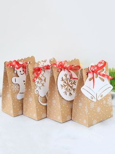 small brown paper bags with christmas decorations on them