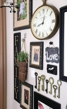 a wall filled with pictures and clocks on top of it's sides, hanging from the wall