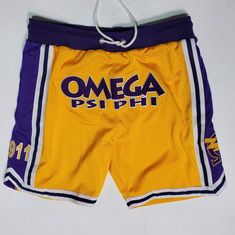 Be summertime-ready in these embroidered Omega Psi Phi shorts. With '1911' and the Omega with bolt featured on the side of each leg, you'll be one of the most stylish Bruhz OWT-side!  Features: -Embroidered Omega with lightning bolt on side of each leg -Notched sides at bottom hem -Drawstring for adjustment capability Throwback Short Bottoms For Sports Events, Throwback Sports Shorts, Summer Throwback Style Short Bottoms, Collegiate Athletic Shorts For Summer Sports, Collegiate Style Athletic Shorts For Summer Sports, Summer Athletic Shorts For Sports Events, Summer Sports Event Bottoms In Short Length, Spring Sports Knee-length Shorts, Collegiate Style Cotton Bottoms For Summer