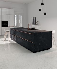 a kitchen with marble counter tops and white chairs in the background, along with an island