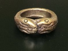 "This is a perfect and unique style magic ring made of brass metal by Lp Imm from Hua-khao temple. The power of the ring is to protect all dangers including ghost, evils and devils and the ring can bring good luck, fortune and wealth to the wearer. The ring showcases an elegant design with unique holy amulet. It is great to get this ring for your loved one or treat yourself for a classic timeless style. Amulet Name: Magic Nakabast Magic Ring Ring details: The exact benefit of the talisman and symbol means Naga lasso (Buang Nak Bas) ring Lucky amulet... Protection from danger.\" Those who own it know well the phrase, \"If you have something to eat... you won't go hungry. You eat like a snake eats its tail, and each one eats. The more you eat, the more they come together. When they hit each Symbolic Bronze Jewelry For Rituals, Symbolic Bronze Ceremonial Jewelry, Ceremonial Symbolic Hand Cast Rings, Symbolic Bronze Jewelry For Ceremonial Occasions, Ceremonial Symbolic Bronze Jewelry, Ceremonial Antique Finish Jewelry Ring, Ceremonial Ring With Antique Finish, Ceremonial Antique Finish Ring, Symbolic Antique Finish Ring Jewelry