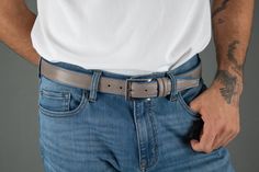 The Back Nine Golf Belt is just what every gentleman needs for those casual days. Pair this belt with shorts, jeans, or khakis and you are ready to conquer the day. With its distinguished full-grain leather over nylon, this leather belt adds a pop of color to your outfit. Handcrafted in Italy, this leather belt is perfect to complete your look on the golf course. You can wear this golf belt as a casual item around the house or when out and about. The double keeper and nickel buckle are sure to k Belts With Jeans, Golf Belt, Belts For Men, Men's Belts, Light Jeans, Jeans For Men, Fabric Belt, Tan Lines, Leather Belts