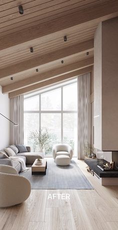 a large living room with wooden floors and white furniture in front of a big window