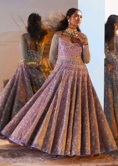 Looking for a versatile ethnic wear then go for the aqsa anarkali gown which is every bit regal. It has mirror work combined with hand embroidery and floral motifs that give an appearance of a walking diva to the wearer. To make it one of a kind, the attire has tassels at its back with sleeves made out of sheer fabric. Organza Sleeves, Anarkali Gown, Organza Dupatta, Flagship Store, Mirror Work, Sheer Fabric, Custom Tailoring, Floral Motifs, Sheer Fabrics