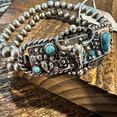 Embrace your inner boho cowgirl with our Handcrafted Boho Rodeo Western Navajo Rhinestone Turquoise Stretch Bracelet. This stunning piece is not only stylish, but also handcrafted with care and includes a beautiful gift box. Complete your look with this unique and versatile accessory. LENGTH: 6.75" WIDTH: 1" Adjustable Stretch, Ships in Gift Box, FAST shipping Bohemian Adjustable Bracelets With Concho, Western Style Concho Bracelets For Festivals, Western Concho Bracelets For Festival, Adjustable Bohemian Concho Bracelets, Bohemian Adjustable Concho Bracelets, Western Style Turquoise Bracelet With Concho, Western Turquoise Bracelets With Concho, Adjustable Turquoise Western Bracelet, Western Turquoise Bracelet With Concho