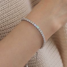 This bracelet is the prettiest and daintiest bracelet! It is perfect to add to any stack. Instead of a clasp, makes for a way easier way to get it on and off by yourself. It also allows you to wear it tight or loose, whatever you need. The cubic zirconia are so realistic. It is an excellent replacement for a real diamond bracelet. Buy the Sterling Silver Bracelet, 3mm Round CZ Stone 4Prong Set Adjustable Tennis Bracelet for yourself or as a gift. Find vintage inspired eternity bracelets at Doubl Flexible Cubic Zirconia Tennis Bracelet As Gift, Dainty Adjustable Tennis Bangle Bracelet, Dainty Adjustable Bangle Tennis Bracelet, Dainty Tennis Bracelet With Sparkling Stones For Gift, Everyday Bracelets With Prong Setting, Dazzling Adjustable Tennis Bracelet, Adjustable Dainty Diamond White Bracelets, Classic Adjustable Sparkling Bracelets, Classic Adjustable Sparkling Bracelet