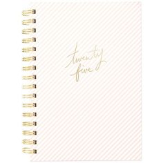 a spiral notebook with the words twenty five written in gold foil on top of it