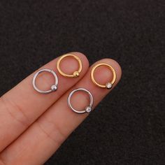 Buying Option: - $14.99 for Single Piece- $19.99 for a Pair (you can choose 2 different earrings)*Comment your option of patterns and color on "Personalization"----------- DESCRIPTIONS ------------ Color: Silver/ Gold - Patterns: Smooth Hoop/ CZ Hoop- Gauge: 16G - 1.2mm- Diameter: 8mm- Stainless Steel Ball: 4mm- Materials: 316L Stainless Steel, 18K Gold Plated, Cubic Zirconia- SKU: HSPJ227- 316L Stainless Steel is hypoallergenic, generally safe for sensitive skin.----------- MIX MATCH PURCHASE - Single Round Metal Cartilage Earring, Nickel Free Minimalist Metal Piercings, Nickel-free Minimalist Metal Piercings, Minimalist Nickel-free Metal Piercings, Trendy Metal Hoop Piercings, Minimalist Metal Huggie Cartilage Earrings, Minimalist Internally Threaded Metal Hoop Earrings, Everyday Hypoallergenic Metal Cartilage Earrings, Everyday Hypoallergenic Cartilage Earrings