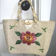 Woven Natural Straw Real Shells Handle Beach Purse With Flower Nwot 12x10. Hand Bag. Ladies. Beach. Vacation. Lined Inside. Inside Zip Pocket. Spring Beach Shoulder Bag With Floral Print, Spring Floral Print Shoulder Bag For Beach, Embroidered Bags For Summer Vacation, Floral Print Summer Bags, Summer Beige Floral Print Shoulder Bag, Embroidered Straw Bag For Everyday Summer Use, Embroidered Straw Bag For Summer Travel, Summer Embroidered Straw Bag, Summer Floral Print Tote Bag