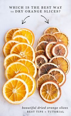 orange slices cut in half and arranged on a white counter top with the words which is the best way to dry orange slices?