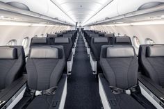 the inside of an airplane with rows of seats