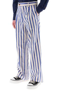 Straight-leg pants by Vivienne Westwood crafted of lightweight organic cotton with a striped pattern. They boast an unusual back strap closure added to a classic front zip fly with button tab, and are finished with double front pleat and belt loops. Side slip pockets, one buttoned back welt pocket. They come unhemmed to allow further tailoring. The model is 187 cm tall and wears a size M. Size Info STANDARD Color Detail Mixed colours Made In Italy Material 100%CO Season One spring Season Two sum Pinstripe Wide Leg Cotton Bottoms, Wide Leg Pinstripe Cotton Pants, Chic Striped Cotton Pants, Striped High-waisted Pants With Belt Loops, Cotton Wide-leg Pants With Vertical Stripes, Fitted Cotton Pants With Vertical Stripes, Striped Cotton Wide-leg Pants, Striped Spring Pants With Belt Loops, Spring Striped Pants With Belt Loops