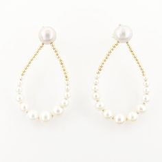 "Wonderful pearls hoops earrings oval shape, earrings with white pearls an diamonds in 18k yellow gold. The \"Fiona\" earrings are the perfect jewel for being elegant and fashion. Pearls earrings are the musthave of the Summer! Perfect also for a bride during her wedding day. - material: gold 18kt 750/1000 - Pearls: 28 white pearls, freshwater gradient pearls, from 3mm to 10,5mm, round - Total weight earrings: 10,10 gr (4,3 of gold; 5gr of pearls) Like all our jewels, the earrings were designed, Elegant Oval Hoop Earrings With Ear Wire, White Hoop Earrings With Pearl Chain For Gift, White Hoop Earrings With Pearl Chain As Gift, Elegant Oval Hoop Earrings For Wedding, White Hoop Bridal Earrings For Formal Occasions, White Hoop Pearl Chain Jewelry, White Hoop Earrings With Pearl Chain, Oval Pearl Drop Earrings In Pearl White, White Oval Pearl Earrings