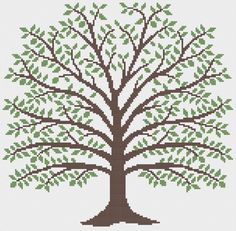 a cross stitch tree with green leaves