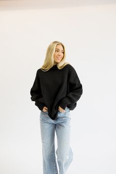 The coziest, most comfortable sweater! It is so versatile and looks good with everything. Everyone needs a sweater like this in their closet! Fits true to size being oversized. Order your true size! Styled with our 90’s High Rise Jeans. Model Info: Makena is 5’6 wearing size S/M. Relaxed Fit Turtleneck Sweatshirt For Fall, Oversized Cropped Sweater For Layering With Ribbed Cuffs, Relaxed Fit Turtleneck Sweater For Loungewear, Everyday Knit Sweatshirt With Ribbed Cuffs, Knit Sweatshirt With Ribbed Cuffs, Oversized Versatile Sweatshirt, Cozy Black Sweatshirt For Loungewear, Oversized Cropped Sweater With Ribbed Cuffs For Fall, Relaxed Fit Soft Knit Cropped Sweater For Everyday