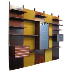 a wooden shelf with many different colored shelves