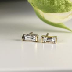 14k Gold baguette diamond stud earrings. DETAILS ABOUT THE EARRINGS ***14k solid gold settings ***Baguette Diamond size 4x2mm 0.07ct each ***Total carat weight 0.14 ctw *** Diamonds are HG color , VS clarity scale. Diamond is a stone that truly states, “I love you” in a deep way, it is symbol of deep, everlasting love. A diamond is forever. Diamond is birthstone for April. You can purchase single or pair, please choose from drop down menu. ----------------------------------- FOLLOW ME HERE: Inst 14k Gold Baguette-cut Diamond Earrings For Formal Occasions, Fine Jewelry Baguette Cut Diamond Earrings, Modern Diamond White Baguette Cut Earrings, Modern Yellow Gold Diamond Earrings With Baguette Diamonds, 14k Gold Baguette Cut Diamond Earrings, Emerald Cut Baguette Diamond Anniversary Earrings, Emerald Cut Baguette Diamond Earrings For Anniversary, Modern Baguette Cut White Diamond Earrings, Modern Baguette Diamond Earrings For Gift