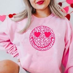 Red and Pink Leopard Smile Face Sweatshirt Leopard Valentines | Etsy Pink Long Sleeve T-shirt With Heart Graphic, Casual Pink T-shirt With Heart Print, Cute Long Sleeve T-shirt With Heart Print, Cute Pink Smiley Face Top, Pink Casual Sweatshirt With Heart Graphic, Cute Pink Sweatshirt With Screen Print, Casual Pink Sweatshirt With Heart Graphic, Playful Pink Sweatshirt With Letter Print, Pink Long Sleeve T-shirt With Funny Print