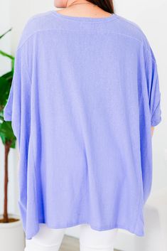 No need to compare this cutie, this is the perfect top for you! The comfy, flowy fit makes this tunic a go-to for comfort and style! Plus, the gorgeous lavender color adds a touch of sass to any outfit! Expertly crafted for ultimate comfort and style! 100% Cotton Flowy Short Sleeve Tops For Loungewear, Flowy Relaxed Tops For Spring, Purple V-neck Solid Color Top, Purple V-neck Solid Top, Purple V-neck Top, Purple Soft-washed Relaxed Fit Tops, Soft-washed Tops For Spring, Soft-washed Cotton Purple Top, Soft-washed Purple Cotton Top