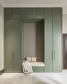 an empty room with green cabinets and a bench in the center, along with white marble flooring